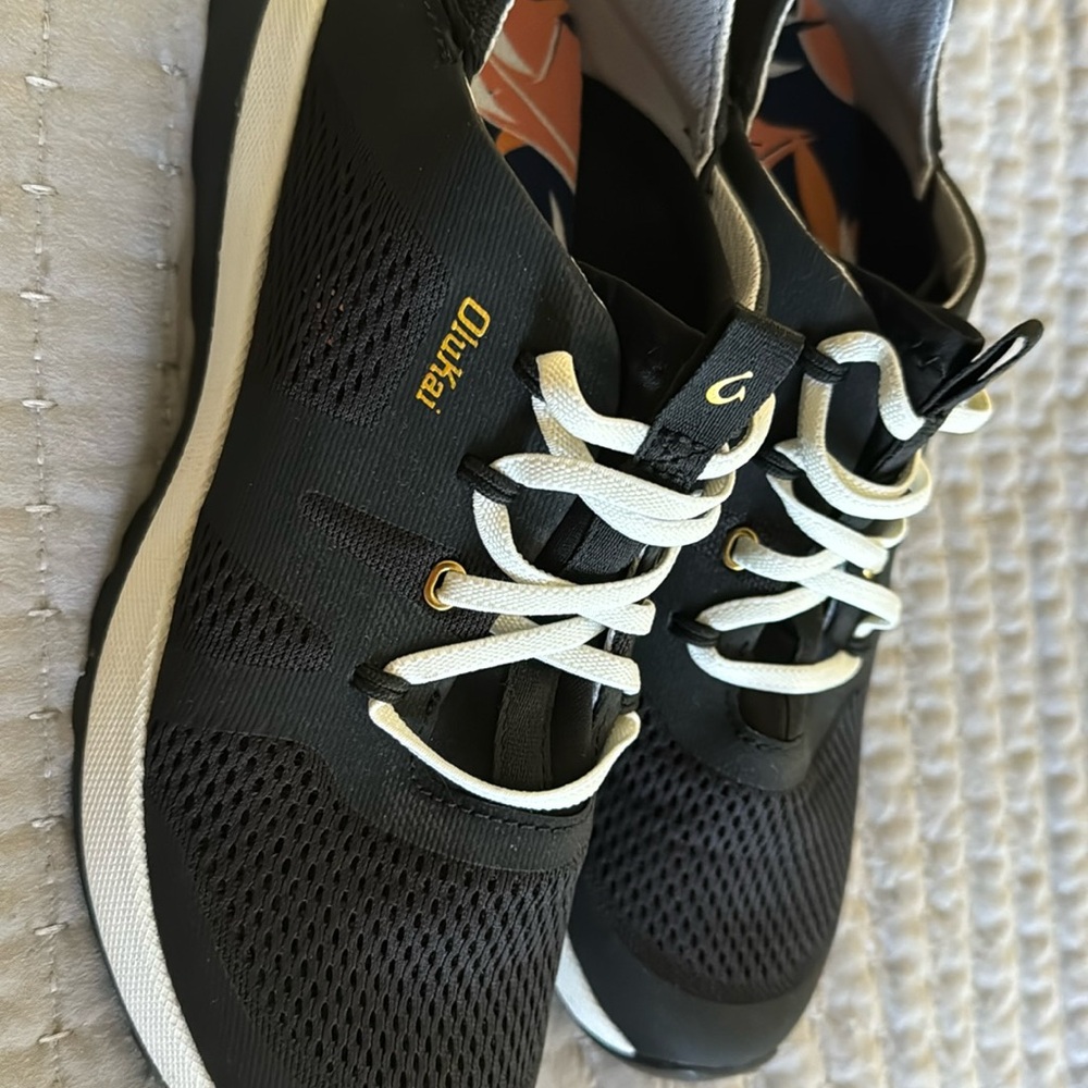 Olukai Huia sneakers, Black, no tie slip on style. Only worn one time, like new.